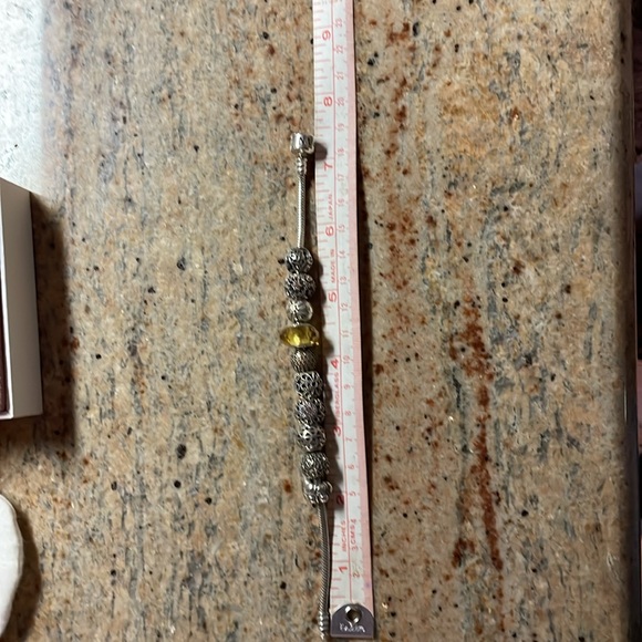 Authentic Pandora bracelet with 10 charms - Picture 5 of 5